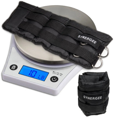 Black nylon adjustable ankle and wrist weights with metal D-rings displayed on a digital scale showing 1.7 pounds, alongside a matching black carrying pouch labeled Synergee.