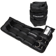 Black adjustable wrist and ankle weights by Synergee with neoprene padding, velcro straps, and metal D-rings for attachment. Set includes wrist cuffs and ankle weights with weight compartments.
