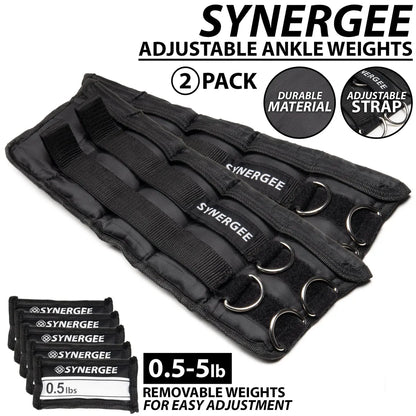 Pair of black adjustable ankle weights with multiple metal D-rings, neoprene padding, and velcro straps, shown with removable weight inserts ranging from 0.5 to 5 pounds.