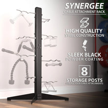 Black vertical cable attachment rack with eight storage posts holding various cable machine attachments, wide base stand, and black powder-coated steel construction.