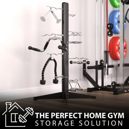 Black cable attachment rack with vertical post and multiple horizontal arms holding various exercise attachments including rope, bar, and handle attachments. Exercise balls visible in background.