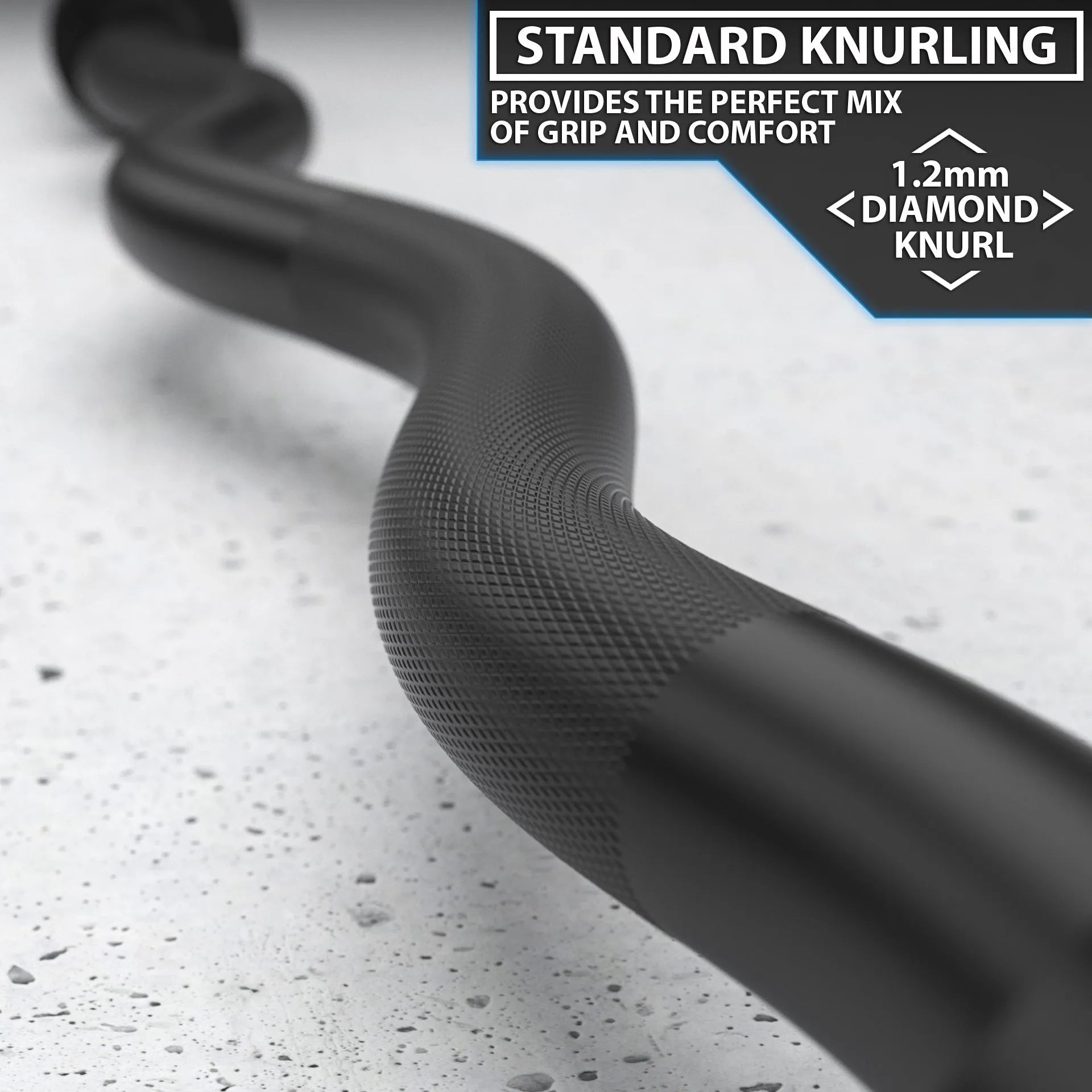 Close-up of a black EZ curl bar showing the textured knurled grip section and curved handle design on a speckled gray surface.