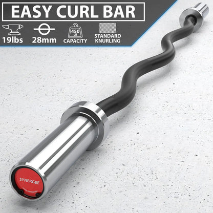 Black and silver curved barbell with textured grip, chrome sleeves, and red end cap labeled Synergee on concrete background. Specifications show 19lbs weight, 28mm diameter, and 450lb capacity.