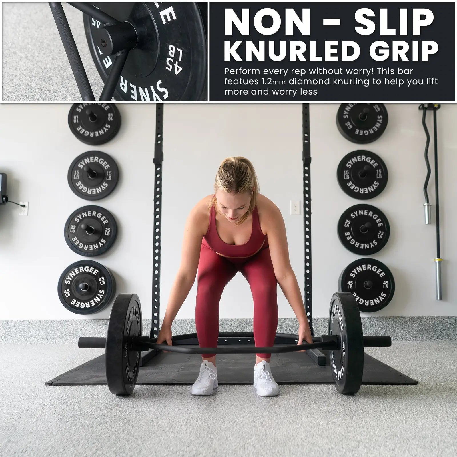 Woman performing a deadlift with a black hex trap bar loaded with weight plates in a gym. Close-up detail shows the knurled grip texture of the bar.