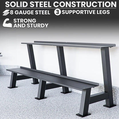 Dark gray steel weight plate storage rack with two horizontal shelves and three supportive legs on a concrete floor.