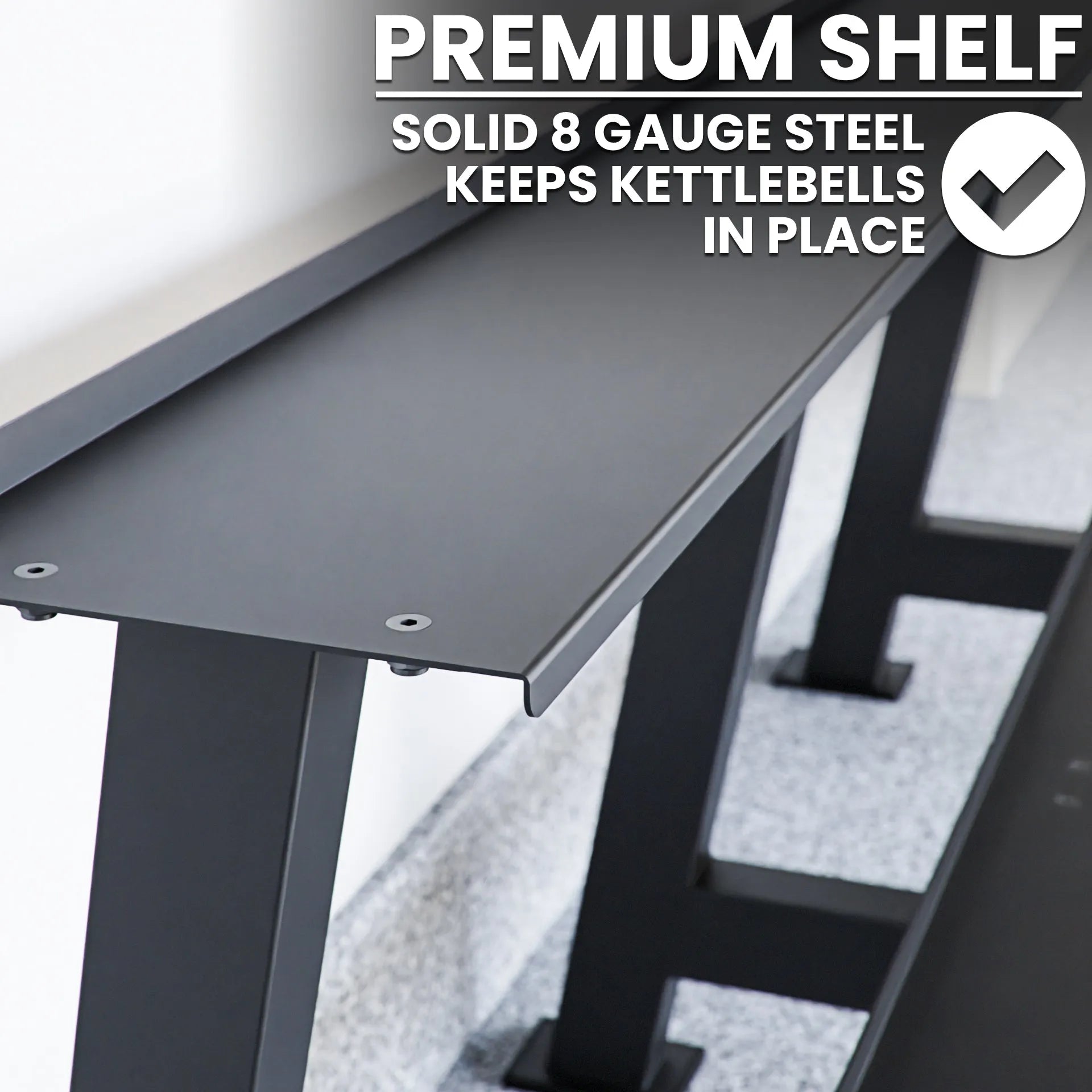 Dark gray steel kettlebell rack with solid 8-gauge steel shelf and angled storage slots designed to hold kettlebells securely in place.