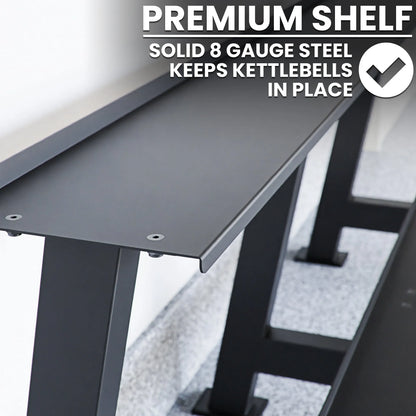 Dark gray steel kettlebell rack with solid 8-gauge steel shelf and angled storage slots designed to hold kettlebells securely in place.