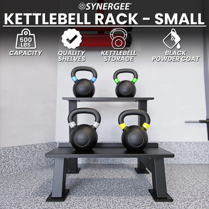 Black powder-coated kettlebell storage rack holding four kettlebells with colored handles on two tiered shelves in a gym setting. Synergee brand rack with 500 lbs capacity.
