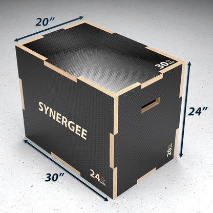 Black and natural wood plyo box with textured rubber surface and top, measuring 20" by 30" by 24" height. Box displays "SYNERGEE" branding and weight capacity markings on sides.