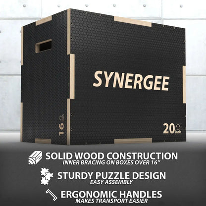 Black plyo box with natural wood trim and handles, labeled "Synergee" with 20-inch and 16-inch height measurements visible on the sides. Textured non-slip surface with solid wood construction and puzzle-design assembly.