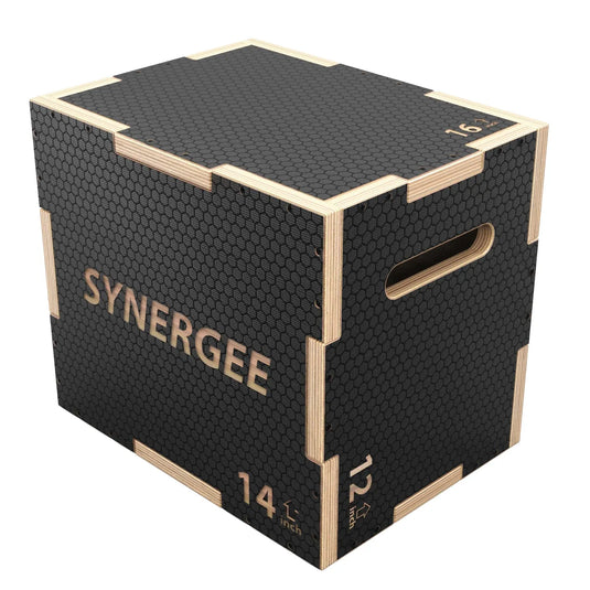 Synergee wooden plyo box with black rubber-textured top surface, natural wood edges, and side handles. Box labeled "14 inch" with textured rubber coating on all sides for non-slip grip.