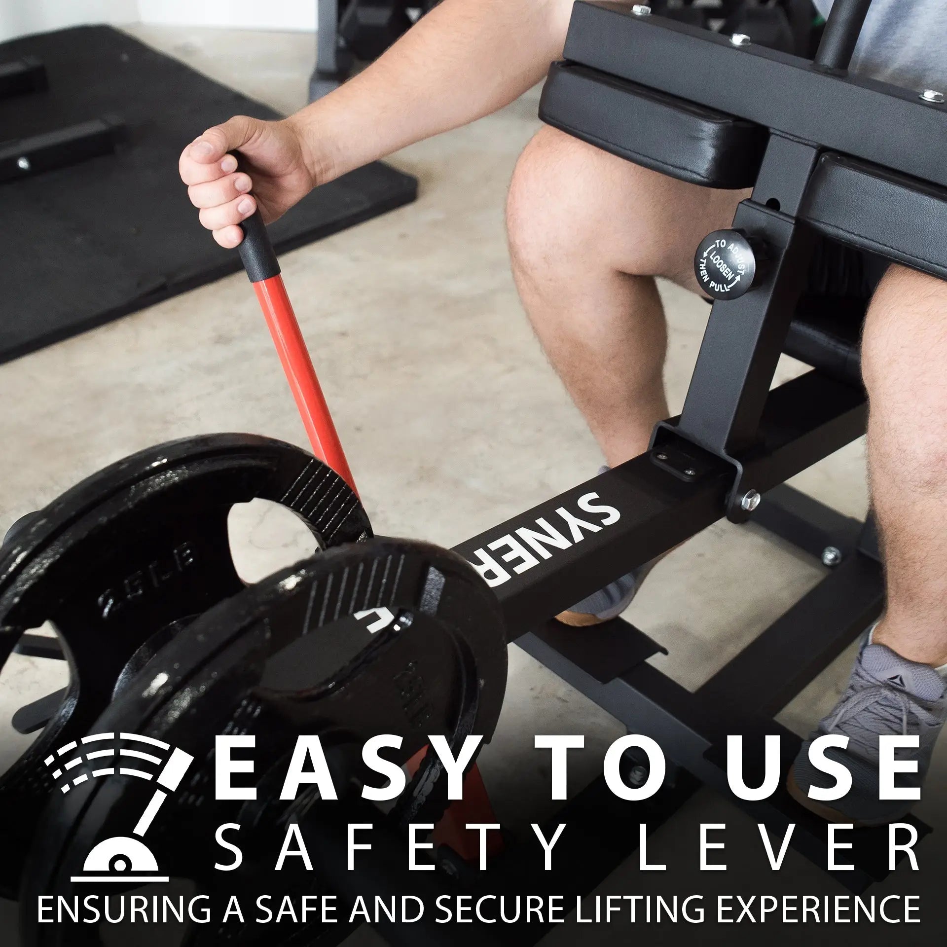 Man using a black seated calf raise machine with red handle and weight adjustment dial visible on the side.