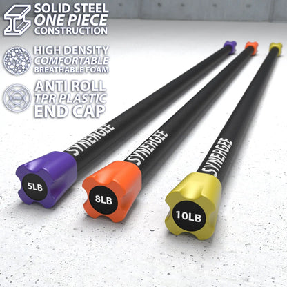 Three weighted workout bars with black steel shafts and colored end caps labeled 5LB, 8LB, and 10LB in purple, orange, and yellow respectively on a concrete floor.