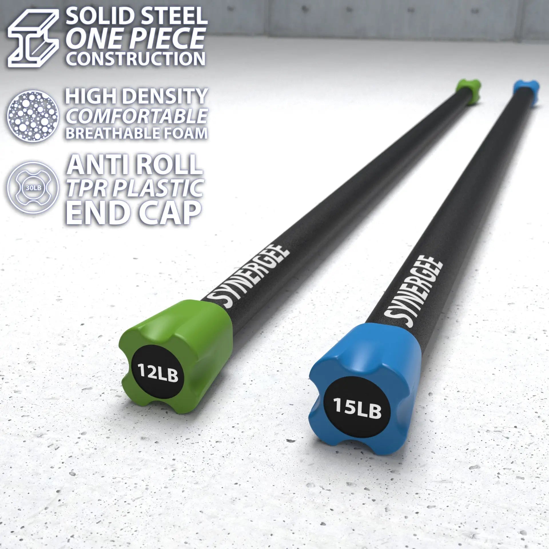Two Synergee weighted workout bars with solid steel construction and colored end caps on a speckled gray surface. The green bar is labeled 12LB and the blue bar is labeled 15LB.