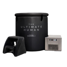A black cylindrical container labeled 'THE ULTIMATE HUMAN' powered by coldlife, accompanied by a small metal cooling unit and a black step stool.