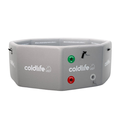 A gray octagonal cold plunge tub with the logo 'coldlife' and text 'Where cold plunging meets culture,' featuring green and red water inlet and outlet indicators.