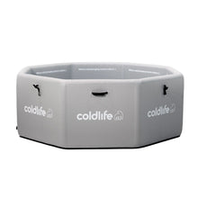 An octagonal cold plunge tub in light gray with the logo 'coldlife' printed on the side, featuring handles for easy transport and text that reads 'Where cold plunging meets culture' inside.